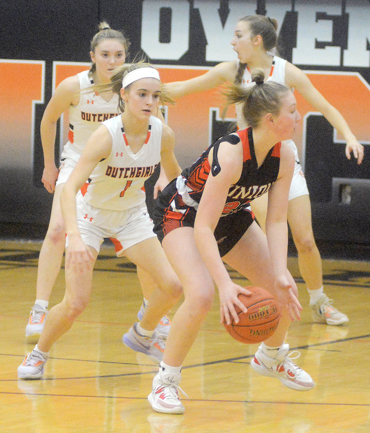 Emma Daniels (far left) keeps her eyes on Union’s Sophia Helling handling the basketball during Four Rivers Conference (FRC) girls basketball action at Owensville High School back in mid-February.